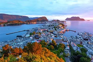 Colorful sunset in Alesund port town on western coast of Norway. Place where the ocean meet the mountains
