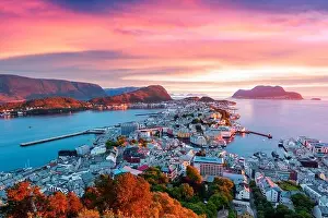 Colorful sunset in Alesund port town on western coast of Norway. Place where the ocean meet the mountains. Landscape photography