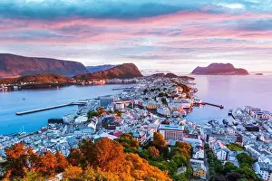 Colorful sunset in Alesund port town on western coast of Norway. Place where the ocean meet the mountains. Landscape photography