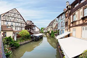 Colorful traditional french houses on the side of river Lauch in Petite Venise, Colmar, France