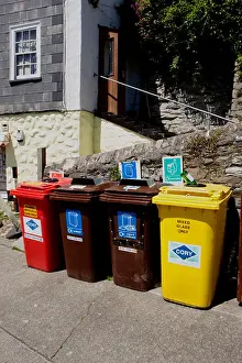 Controlled Prints: Coloured Recycling Bins in quayside in the cornish seaside village of Mevagissey