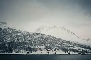 Brim Prints: Colourful cabins in the Lyngen Alps by the arctic ocean in northern Norway