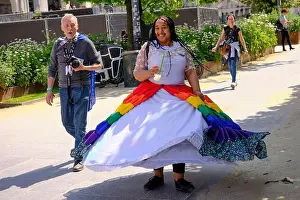 Ethnic Clothing Prints: Colourful gay woman showing off her dress at the Gay Pride Brussels 2023