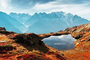 Colourful sunset on Chesery lake (Lac De Cheserys) in France Alps. Monte Bianco mountain range on background. Chamonix, Graian Alps