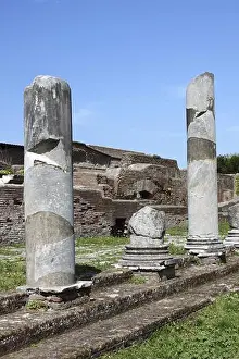 Roman Civilization Prints: Columns of an ancient roman temple in Ostia Antica, the old harbour of Rome Italy