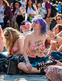 Comedienne Samantha Pressdee sitting down on the Royal Mile in Edinburgh during the The Free the Nipple protest