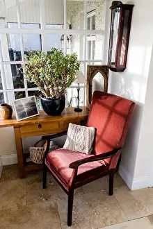 Cushion Prints: Empty comfortable red chair on a porch
