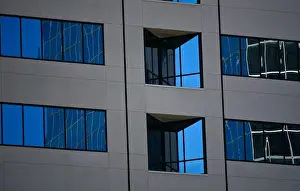 Condominiums Prints: Commercial skyscraper white concrete and blue glass facade in La Jolla, California USA