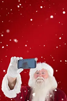 Snowing Prints: Composite image of santa taking a selfie on phone