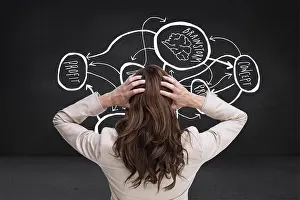 Well Dressed Prints: Composite image of young classy businesswoman with hands on head standing back to camera