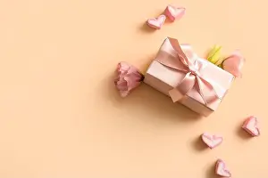 Valentines Prints: Composition with gift box, heart-shaped marshmallows and flowers on color background