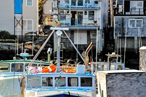 Occupations Prints: Compressed view of a few old, traditional lobster boats against work buildings on a bright summer day