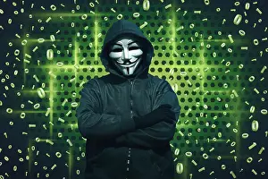 Hacker Prints: Computer hacker with mask standing against binary code in background
