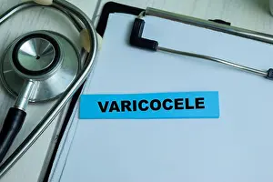 Infertility Prints: Concept of Varicocele write on sticky notes with stethoscope isolated on Wooden Table