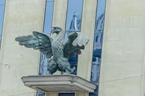 Tbilisi Prints: Concrete eagle on the facade of a gray building; Tbilisi, Georgia
