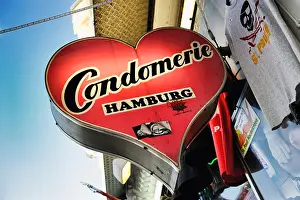 Advertisements Prints: Condomerie, condom shop on Reeperbahn street, St. Pauli, Hamburg, Germany, Europe