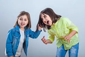 Sisters Prints: conflict between sisters, younger sister pulls the hair older sister