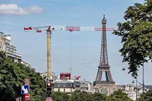 Building Site Prints: CONSTRUCTION SITE CRANE IN FRONT OF THE EIFFEL TOWER