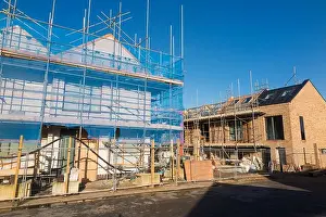 South East Prints: Construction site & partly built townhouses / housing block / new build / building new homes / apartments / flat