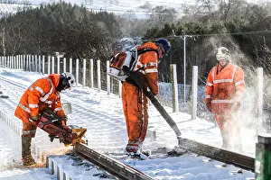 Conscious Prints: Construction workers blowing snow off and cutting new rail line Borders Railway Construction