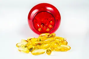 Benefits Prints: Container of fish oil gel capsules of omega 3