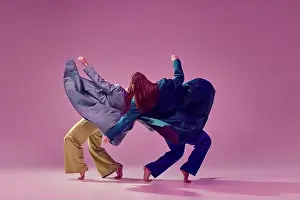 Gymnastic Prints: Contemporary dance couple in motion and action isolated on crystal pink background