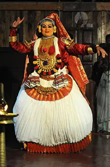 Applying Prints: Contemporary female performer in a traditional Kathakali dance about folk mythologies from the Hindu epics