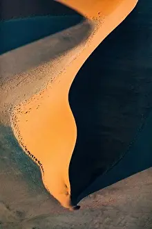 Contrasted abstract of the Oxide rich red sand dunes in the great sand sea of Namibia