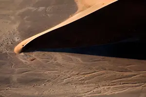 Contrasted abstract of the Oxide rich red sand dunes in the great sand sea of Namibia