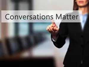 Discussing Prints: Conversations Matter - Successful businesswoman making use of innovative technologies and finger pressing button