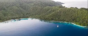 A coral reef surrounds idyllic islands near New Britain in Papua New Guinea. This area is part of the Coral Triangle due to its biodiversity