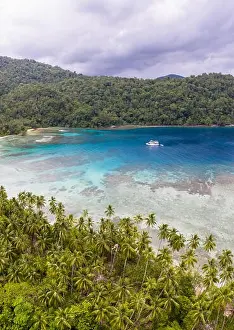 A coral reef surrounds idyllic islands near New Britain in Papua New Guinea. This area is part of the Coral Triangle due to its biodiversity
