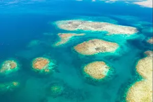 Seawater Prints: Coral reefs and lagoons, top view. Atolls and turquoise sea water. Sea surface