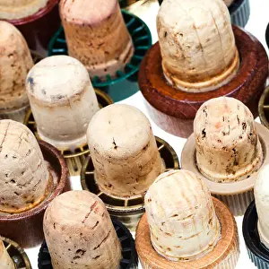 many corks from strong drinks isolated on white background
