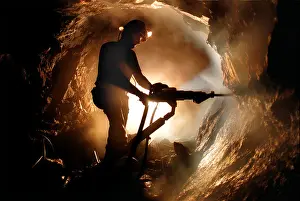 Heavy Prints: A Cornish tin miner at work at the old Geevor Tin Mine near Camborne, Cornwall, UK