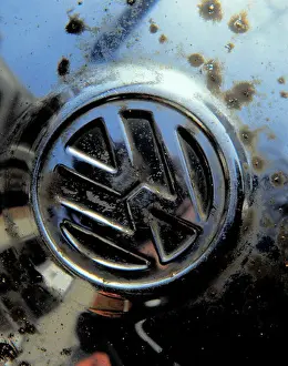 Metallurgy Prints: Corrosion of steel hub cap where surface chromium plate coating has been chipped by road grit