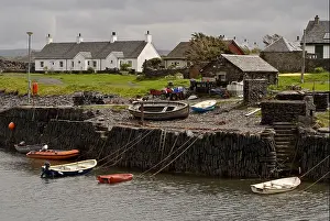 Low Water Prints: Cottages and the ferry dock on Easdale Island a slate island south west of Oban in the west Highlands of Scotland