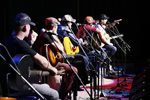 Sailors Prints: Country music artists interact with a crowd during the 9th annual Guitar Pull aboard the air station