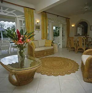 Flower Arrangement Prints: A country sitting room glass topped coffee table with a vase of exotic flowers tiled floor rug