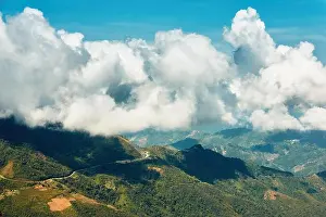 Travel Locations Prints: Countryside in fuffly clouds. Hilly landscape of Borneo in Malaysia