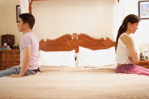 Three Quarter Length Prints: Couple apart at the edge of bed