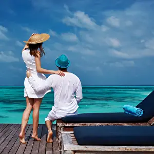 Honeymoon Prints: Couple on a beach jetty at Maldives