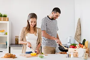 Paprika Prints: couple cooking food at home kitchen