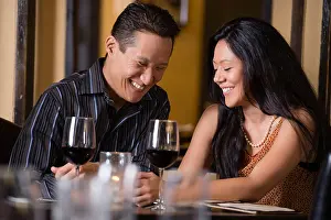 Unwinding Prints: Couple having dinner together in restaurant