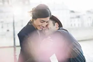 Eyes Closed Prints: Couple hugging along Seine River, Paris, France