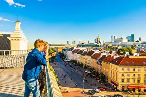 Young Couple Prints: Couple looking at Palace of Culture and Science and skyscrapers