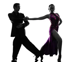 Full Length Prints: one couple man woman ballroom dancers tangoing in silhouette studio isolated on white background