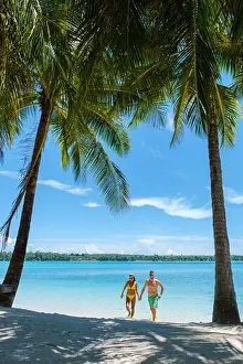 Couple men and women on vacation at a tropical Island in Thailand Koh Mak