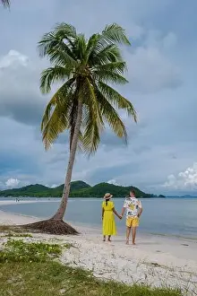 Beauty Of Nature Prints: couple of men and women walking on the beach at the Island Koh Yao Yai Thailand