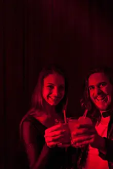 Toast Prints: Couple sharing a drink in a night club